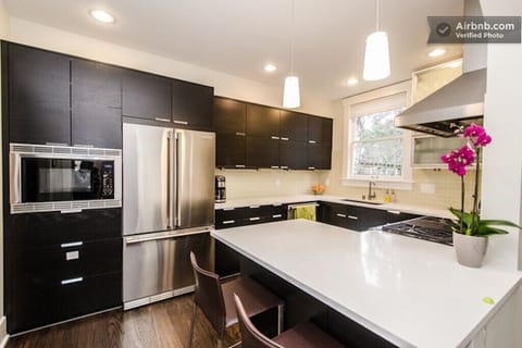 Remodeled kitchen with professional stainless steel appliances.