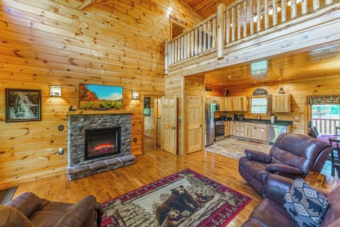 Living Room has an Electric Fireplace with Two Rocking Recliners