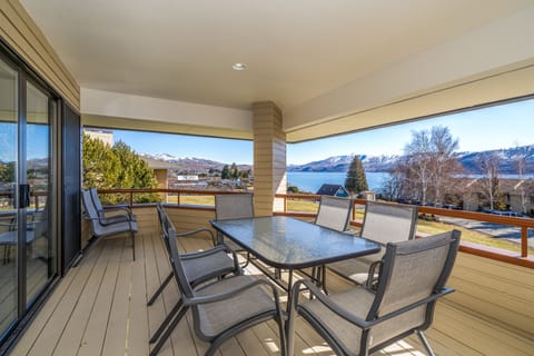 Enjoy lake & mountain views from main level deck with outdoor dining & BBQ grill