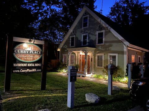 Evening picture of the front entrance to the Curry House, lighted brick pathway!