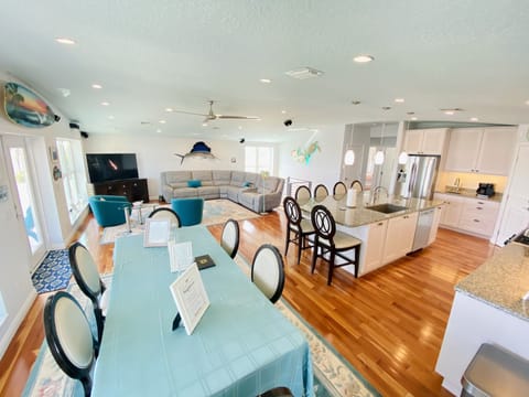 DINING, KITCHEN AND LIVING SPACE.