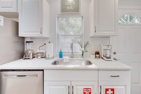 Enjoy a fully equipped kitchen with a coffee maker, coffee, blender, dishwasher, and sink overlooking the backyard. Safety is a priority with a fire extinguisher and first aid kit readily available. Perfect for a comfortable and secure stay!