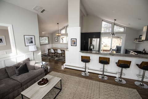 Looking from the great room into the open kitchen and dining area.