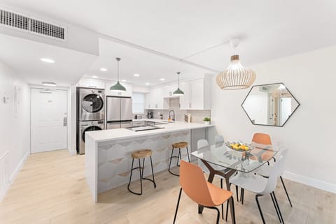 Beautifully designed space with chic decor, stylish dining chairs, and an inviting atmosphere for meals.