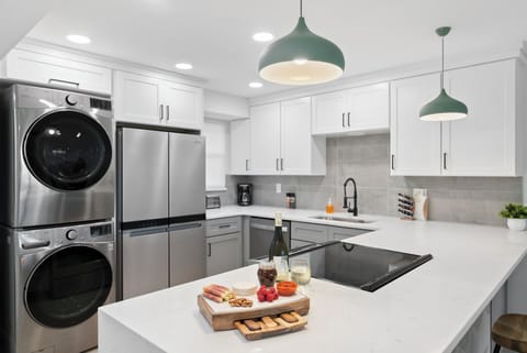 Stylish kitchen with high-end appliances, and a convenient in-unit washer and dryer.