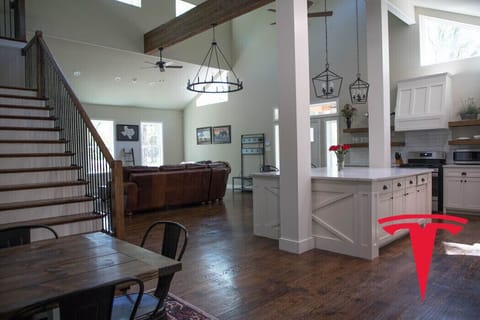 Large open concept living space in front unit with XL kitchen island, gas range.