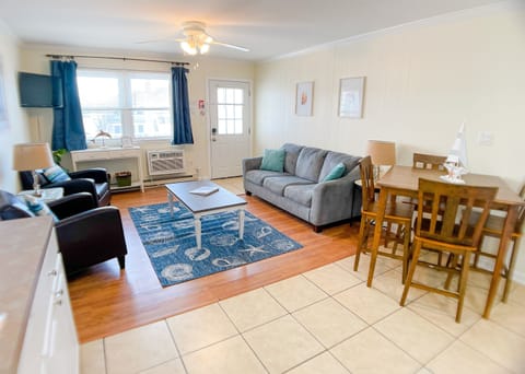 Living and dining room with plenty of seating.
