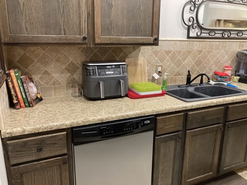 Galley kitchen w/ Keurig & drip coffee maker, toaster oven, air fryer & blender.