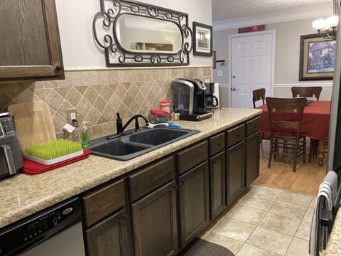 Galley kitchen w/ Keurig & drip coffee maker, toaster oven, air fryer & blender.