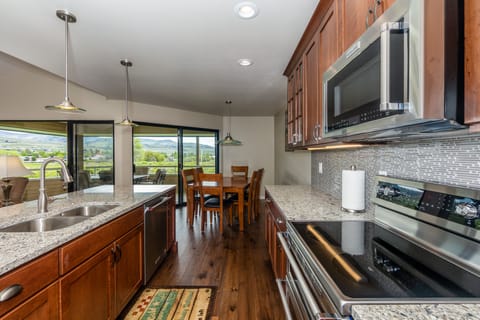 Indoor dining seating for 6 and kitchen bar seating for 3