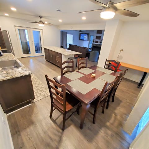 The dining table sits 6 people, island may sit 8 and study/dining tbl may sit 2.