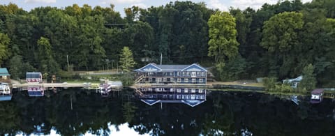 The house sits on 340 ft of lake frontage w/ beach & 2 grassy, level play areas.