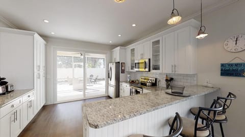 Kitchen looking into screen porch