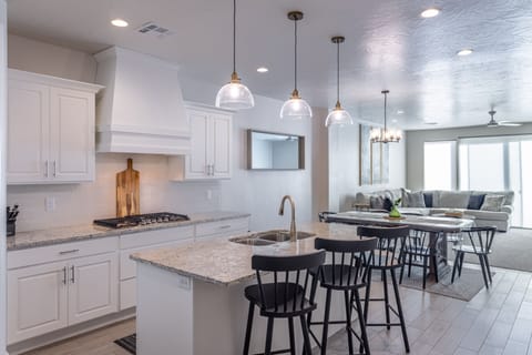 Kitchen Island & Barstools - This sleek, modern kitchen has all the best upgrades to make cooking a breeze!
