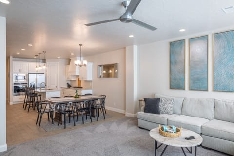 Living Room View Into Kitchen - The Living Room is conveniently located adjacent to the Kitchen and Dining Table and is a great place for entertaining guests during downtime.