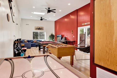 Bright entertainment space featuring a pool table, perfect for family fun and memorable gatherings