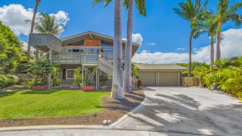 Street view showing off-street parking and front lanais with viewing deck 
