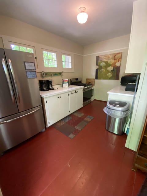 Roadside entrance into first kitchen space, fully stocked, an oven and 2 fridges