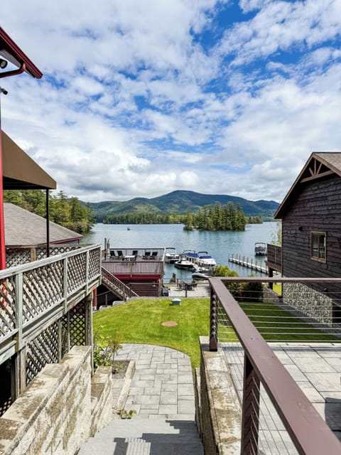 Outside Patio with a fire pit and lounge chairs.  Beautiful view of the lake.