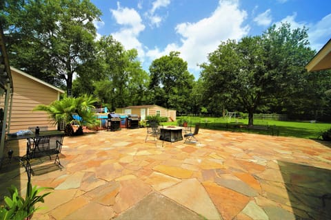 Sprawling green landscape, boundless blue sky, all in a serene setting.