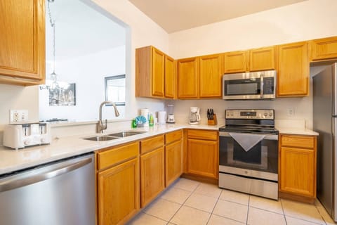 Recently Updated Kitchen with Solid Surface Countertops and Stainless Steel Appliance