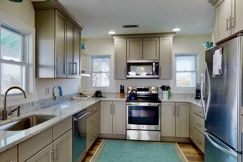 New counters, cabinets, appliances with a plenty of space to move around. This kitchen has it all
