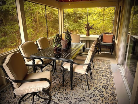 Enjoy screened porch for relaxing or have dinner with new table set