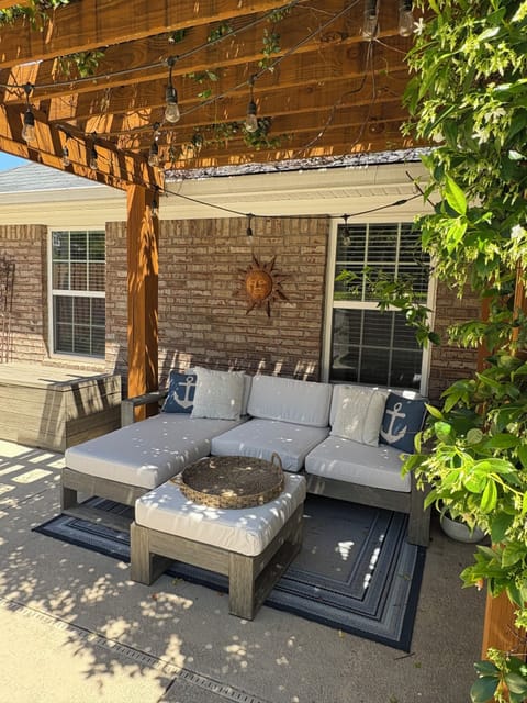 Pergola covered with Confederate Jasmine and garden lights.