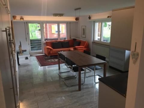 living room with table and balcony