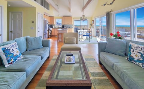 Comfortable living room with kitchen and dining area beyond