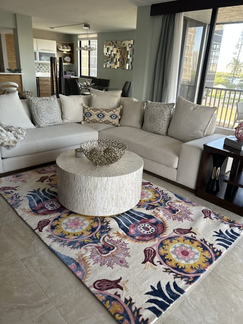 Living area with wrap around balcony with bay views
