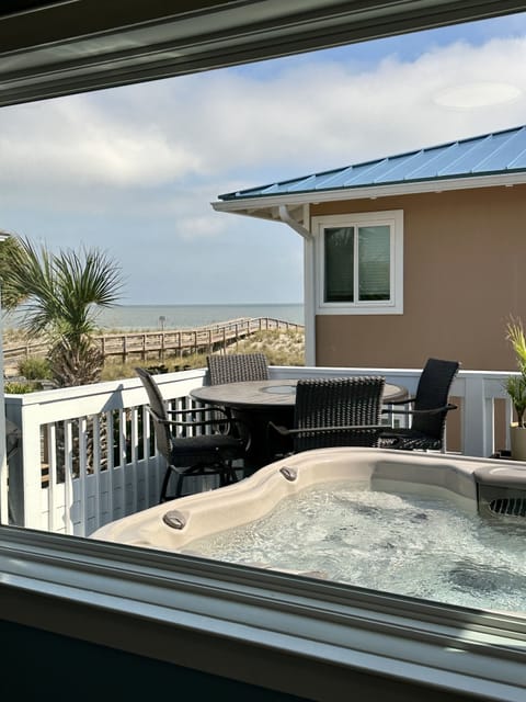 Enjoy a soak in the hot tub as you watch ships pass by, and dolphins swim past.