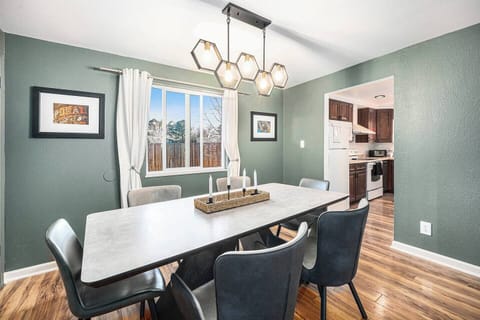 - Gather around this stunning dining table for cozy breakfasts or lively dinners
- Eye catching hexagon lighting sets the mood for unforgettable mealtime moments
- Bask in natural sunlight with backyard views just steps from the kitchen