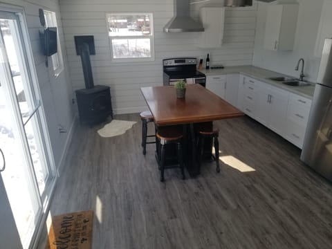 Open concept kitchen/living room. Patio door opens to the dock