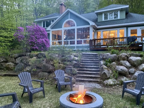 Back yard boasts inviting deck, brand new fire pit, a grill, and plenty of space