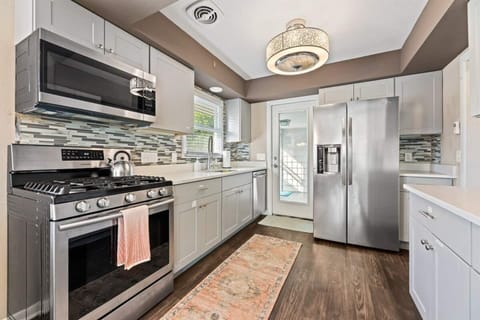 Full kitchen with fridge/freezer, oven/stove , microwave and dishwasher.