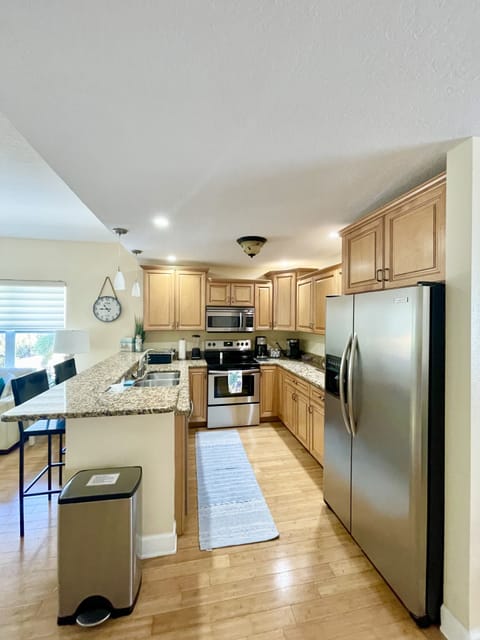 Fully equipped kitchen with toaster oven, blender, Keurig and drip coffee maker.