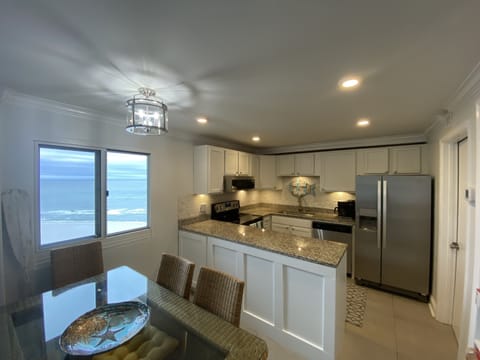 Enjoy meals with a beach view and seating for 6.