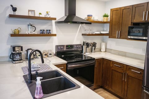 Stocked Kitchen with Modern Over the Range Hood