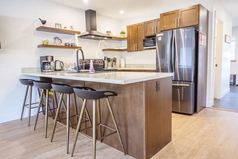 Modern Kitchen with High-end Stainless Appliances Seating for four