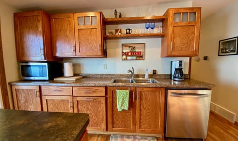 Well equipped kitchen w/stainless dishwasher, microwave, range, and refrigerator