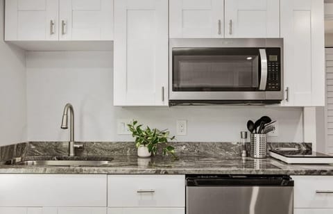 kitchen with K cup coffeemaker, convection microwave and stove top burner