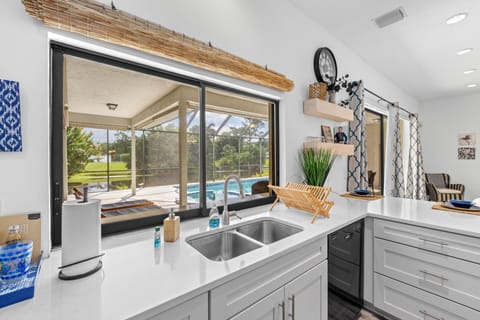 Kitchen pass through window to lanai. 