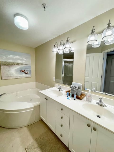 Master has double sinks, whirlpool tub, separate shower