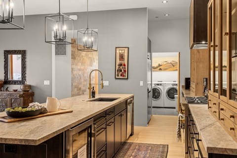 Custom kitchen with full laundry