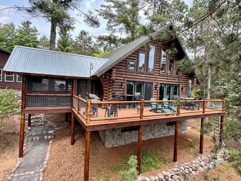 Log cabin with huge wraparound deck and screened porch (view from lake side)!