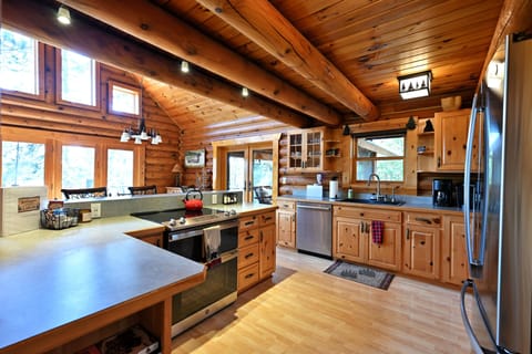 The kitchen opens to the dining area. Gorgeous views all around!
