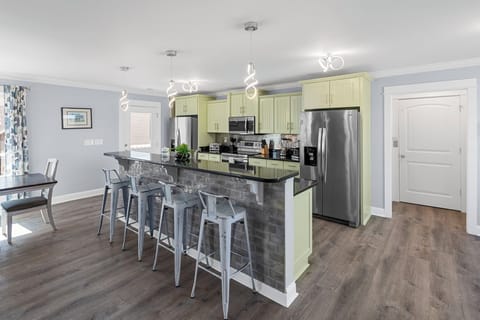 Cook up a feast in the fully equipped kitchen featuring stainless steel appliances. Dishwasher for easy clean up.