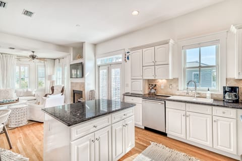 Open Entertaining Kitchen with double french doors to exterior balcony 