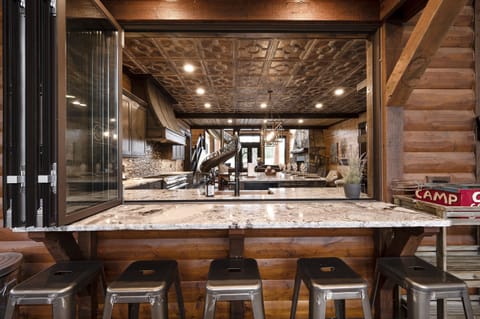 Bring the outdoors in when you open the accordion window to create the pass-through bar.